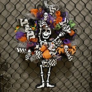 Festive Skeleton Wreath with Colorful Accents